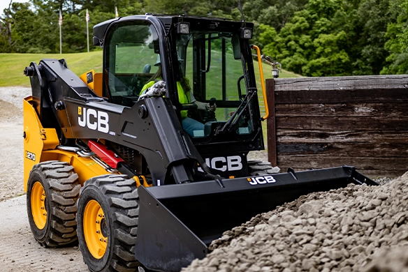 JCB 270 skid steer loader loading aggregate with a general purpose bucket