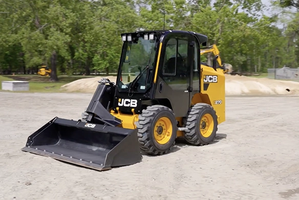 JCB 270 skid steer loader positioned on a level worksite with front bucket