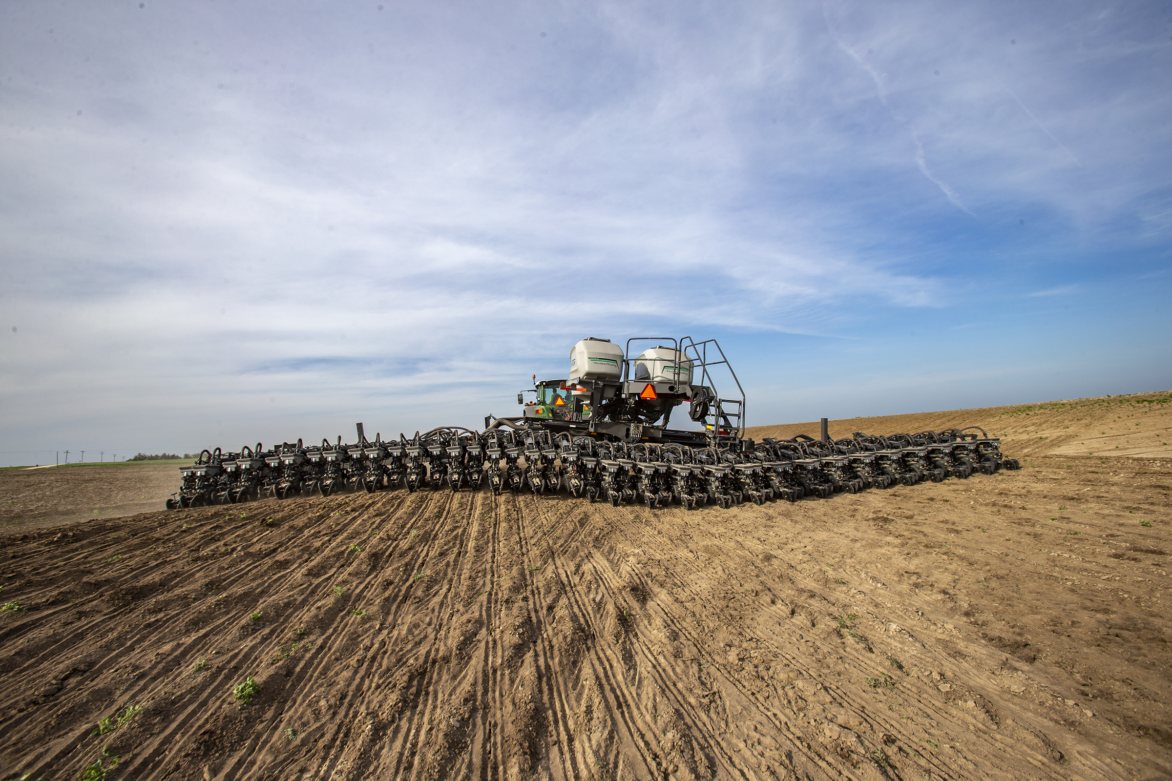 Fendt Momentum planter working across a wide, dry field.