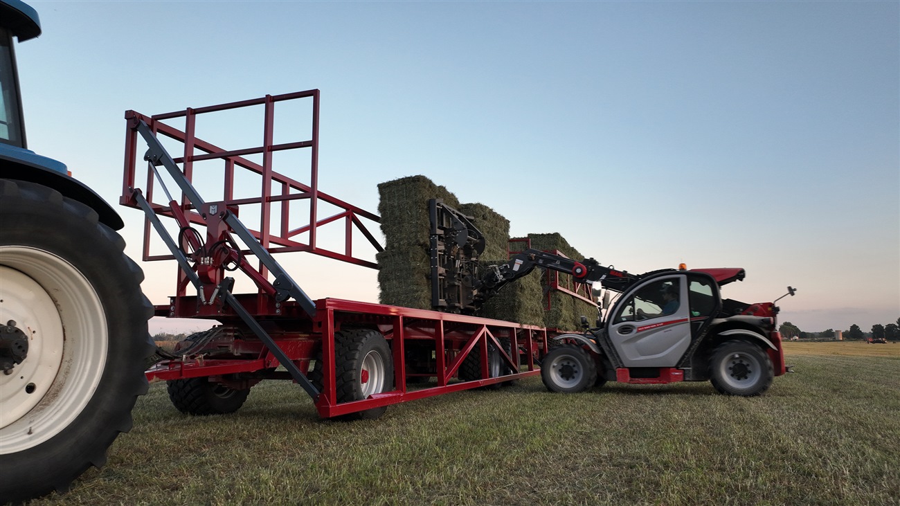 Marcrest equipment transporting bales onto a trailer